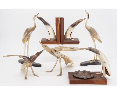 Vintage carved horn ornaments including a pair of birds, tallest 30 cm
