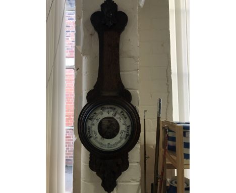 A Victorian carved oak aneroid barometer, 88 cm (a/f)