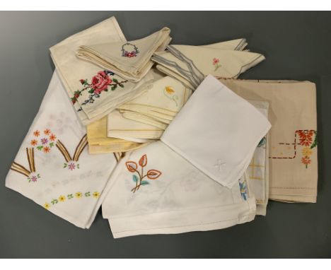 A quantity of vintage hand-embroidered table linens and napkins