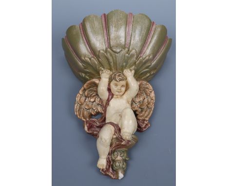 A Baroque style painted ceramic wall pocket in the form of a cherub and shell, late 20th Century, 28 cm