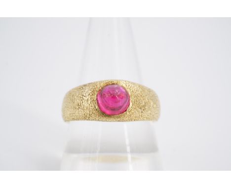 An Imperial Russian 56 Zolotnik standard (14 ct) yellow metal and ruby cabochon ring, the subtly pointed stone of approximate