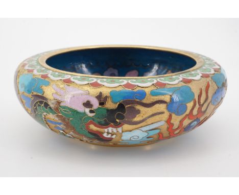 A Chinese cloisonne enamelled bowl decorated with Imperial dragons chasing a pearl, 15 cm