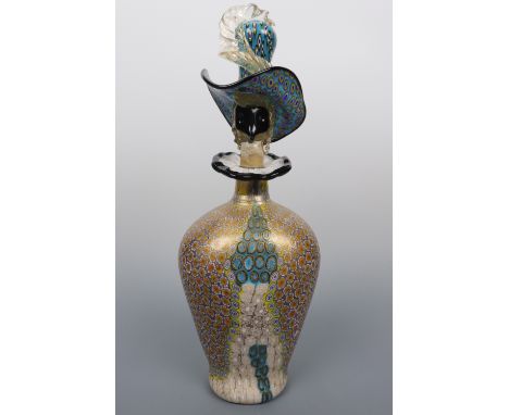 A fine Murano glass stylized figural decanter, the vessel of oval section, the stopper modelled as the head of a woman wearin