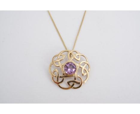 A Celtic-influenced 9 ct gold and amethyst pendant, comprising a circular open interlaced strapwork surrounding a bezel-set b