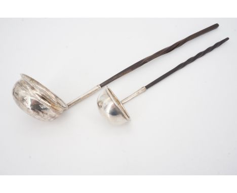 A Georgian white metal toddy ladle with baleen handle, inset with a James II 1686 silver coin, unmarked, together with a Vict