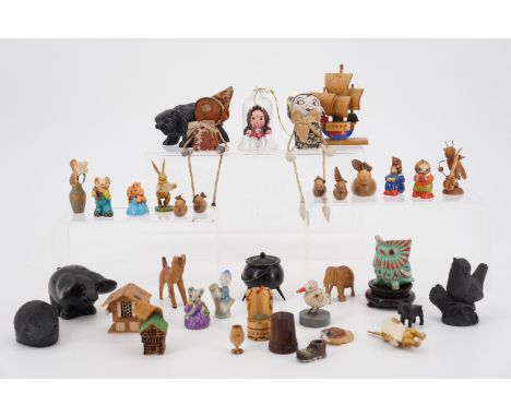 A quantity of wooden and ceramic miniatures novelty figures, animals etc