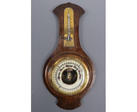An oak barometer / thermometer, 35 cm high