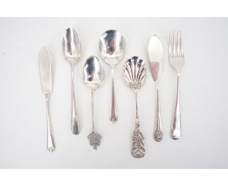 A silver butter knife and preserve spoon pair together with sundry other silver spoons, a butter knife and white metal caddy 