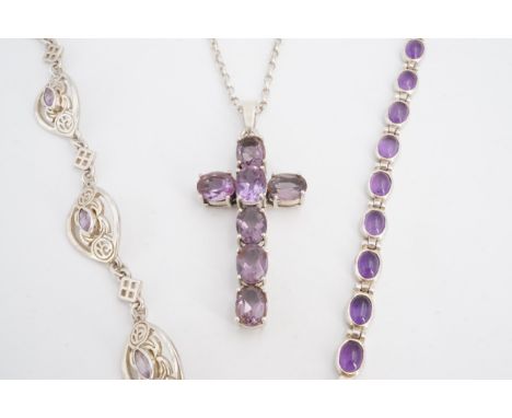 Two amethyst and white metal bracelets together with a similar pendant cross