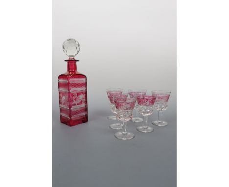 A ruby flashed and wheel cut decanter together with six conforming glasses