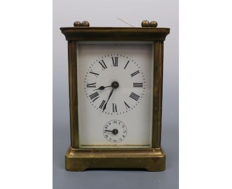 A late 19th / early 20th Century carriage alarm clock, 10.5 cm excluding handle, (a/f)