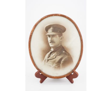 A framed portrait photograph of a Border Regiment officer, 32 cm x 27 cm
