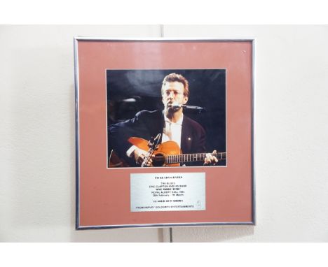 A presentation portrait photograph of Eric Clapton to one of his management team from Harvey Goldsmith Entertainments in reco