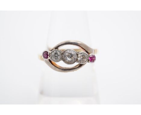 A vintage ruby, diamond and white stone ring, the brilliants millegrain-set diagonally within an open elliptical frame on a y