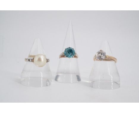 Three yellow metal and paste / faux pearl rings