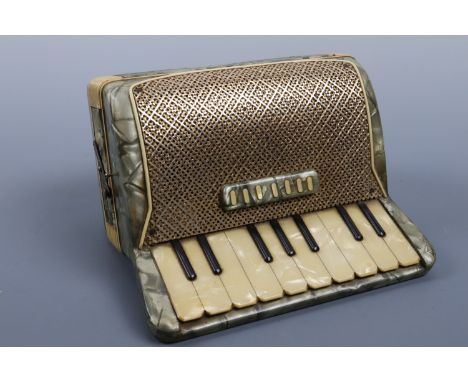 A 1950s novelty celluloid cigarette box modelled as an accordion, 18 cm x 15 cm high
