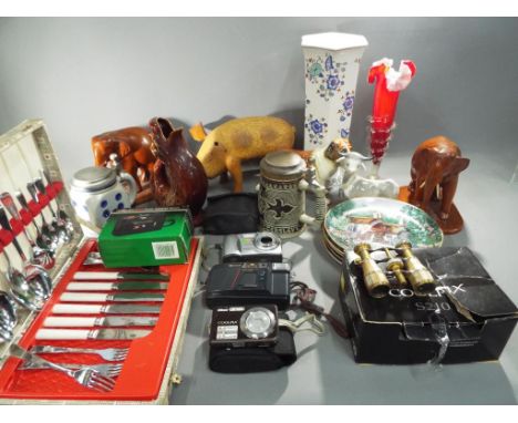 A good mixed lot of vintage cameras, ceramics, wooden animals and flatware, included in the lot is a pair of opera glasses (2
