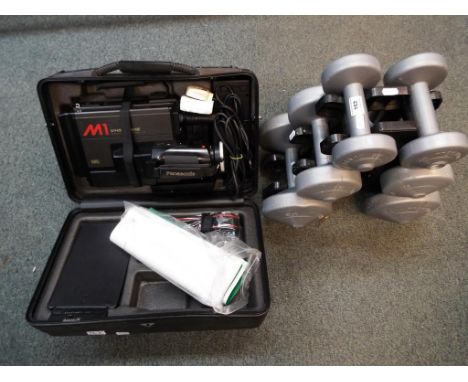 A good mixed lot to include a complete set of six Dumbells resting on a stand, a cased Panasonic VHS movie camera with operat