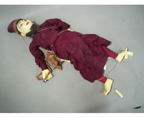A wooden jointed Malaysian string puppet approximate length 70 cm This lot must be paid for and collected (or despatched) no 