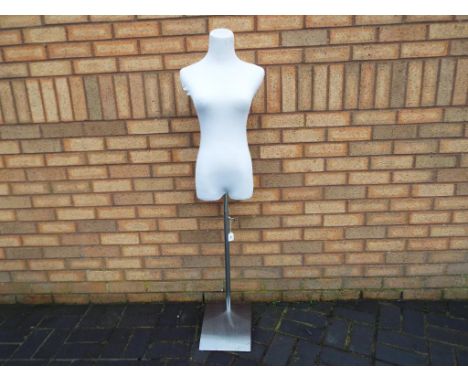 A tailors dummy/mannequin with adjustable chrome stand. The body does detach from stand for transportation. This lot must be 