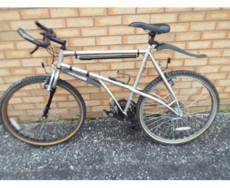 Bicycle - a gentleman's Apollo mountain bike, Shimano gears, upturned grip handle and front fork suspension This lot must be 