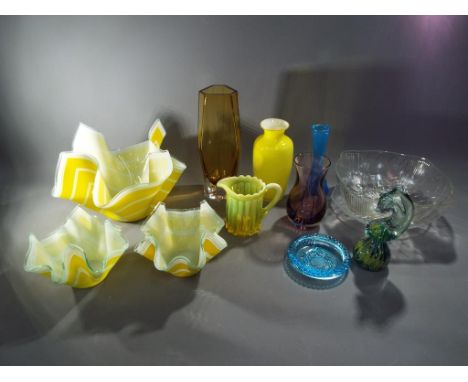 A collection of glassware to include Caithness vase, Mdina seahorse paperweight and similar.  This lot must be paid for and r