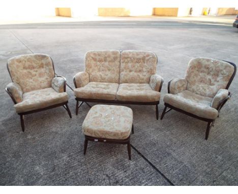 An Ercol lounge suite comprising two seat sofa, two armchairs and a footstool [4] This lot must be paid for and removed no la