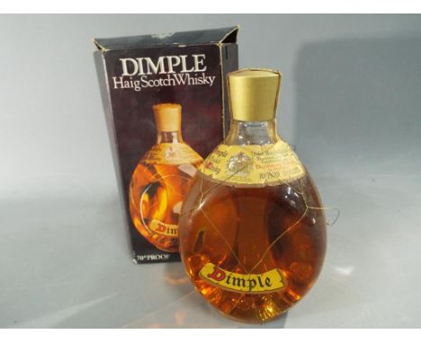 A probable 1970's bottling of Haig Dimple Scotch whisky, 13 1/3 fl oz, 70° proof, contained in original box.  This lot must b