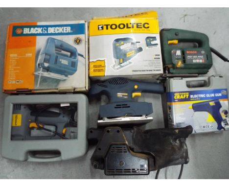 Tools - a good mixed lot of power tools to include jigsaws and sanders also included in the lot is a nail gun and a glue gun,