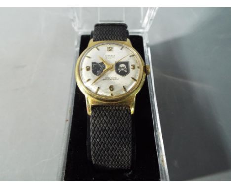 A gentleman's army watch decorated with a German design  This lot must be paid for and removed no later than close of busines
