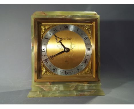 An Elliott onyx cased mantel clock with brass face and silvered chapter ring, retailed by Boodle & Dunthorne, 22 cm (h)   Thi