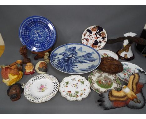 A large and heavy blue and white Asian charger, marked verso with band ink, a quantity of good quality plates and Bossons hea