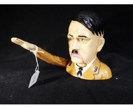 A cast iron nutcracker in the form of Hitler (mechanism works, presumed to be a novelty item not intended for use as a nutcra