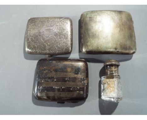 Two George V silver hallmarked cigarette cases, one marked Birmingham assay 1911 with chased decoration, the other Birmingham