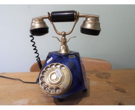 A vintage Italian salon telephone with faceted blue glass body with gilded metal mounts, approximately 27 cm (h) This lot mus