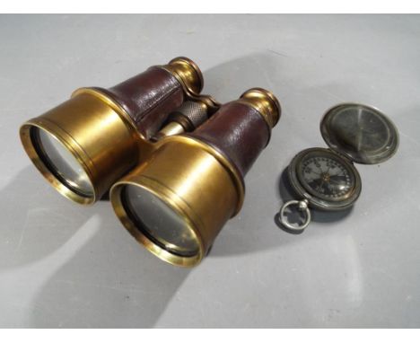 A vintage military compass stamped with broad arrow / crow's foot, a set of Ross brass and leather field glasses marked 1907 
