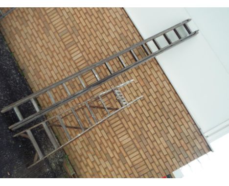 A set of wooden step ladders and a wooden extending ladder. [2] This lot must be paid for and removed no later than close of 