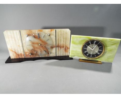 An onyx mantel clock and one similar. [2]  This lot must be paid for and removed no later than close of business on Tuesday