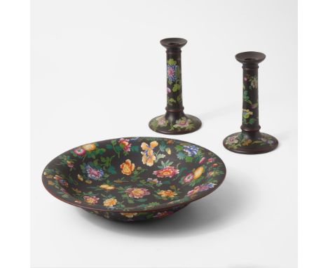 Enamel-decorated stoneware.Comprised of a pair of tall candlesticks and a large (shape 6355) Lily Bowl. Made for Marshall Fie