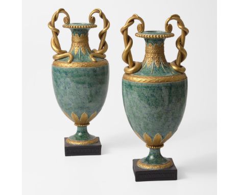 Gilt stonewareMounted on Black Basalt socles.One impressed "WEDGWOOD" the other "Wedgwood"(H: 14 5/8, W: 6 1/8, D: 6 in.)Qty: