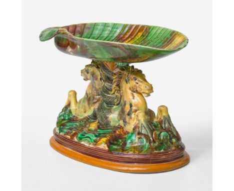 Glazed earthenwareShell form bowl, double hippocamp rising from the sea stem and baseImpressed "WEDGWOOD" and "CMV" (date cod