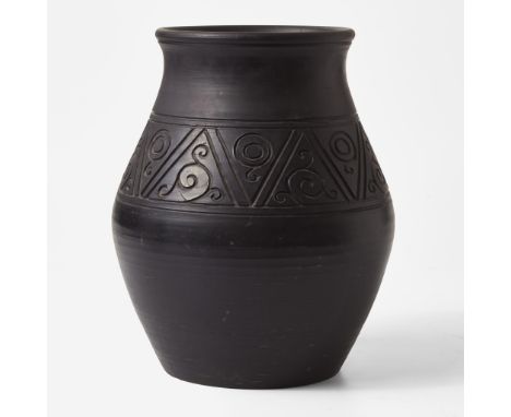 StonewareWith deeply carved incised decoration.Impressed "WEDGWOOD" and "MADE IN ENGLAND".(H: 12 1/4, Dia: 11 in.)Qty: (1)Pro