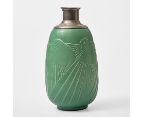 Glazed earthenware, metal mountsWith a molded running freize of stylized doves. Based on the shape 3720 vaseImpressed "WEDGWO