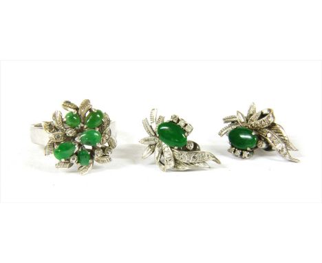 A white gold jade spray ring and earrings suite, c.1970, the ring with pear shaped cabochon jades, three claw set to plain co