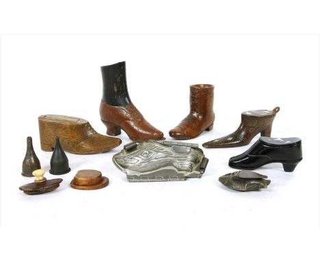 A collection of treen and similar snuff boxes modelled as shoes , to include examples decorated in pique work, some having mo