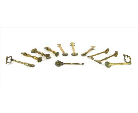 Eleven various 19th century brass pastry cutters, each with roller wheel end, largest 17cm