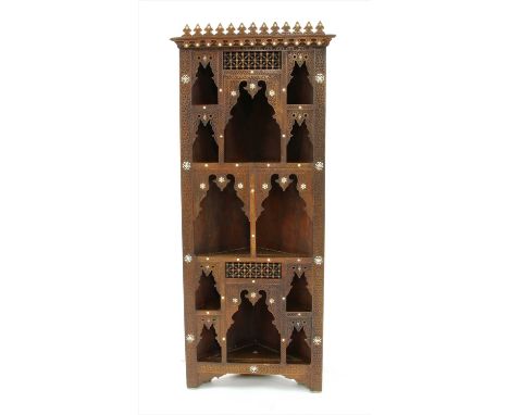 A Syrian hardwood standing corner cupboard, having inlaid mother of pearl detailing, 184cm high