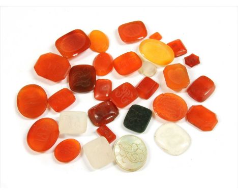 A quantity of loose intaglio engraved hardstone seals, to include agate, cornelian, bloodstone and mother-of-pearl examples, 