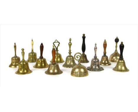 Twelve brass and one silver plated table bells, tallest 14.5cm high