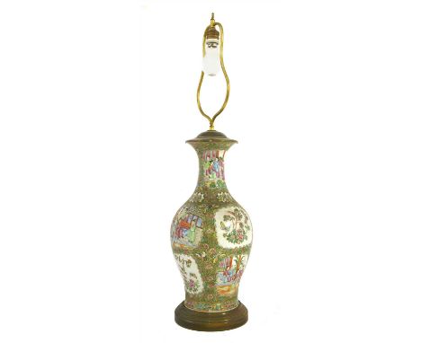 A Chinese Canton enamelled famille rose vase, Qing dynasty (1644-1911), of baluster form with a flared mouth, painted with fi
